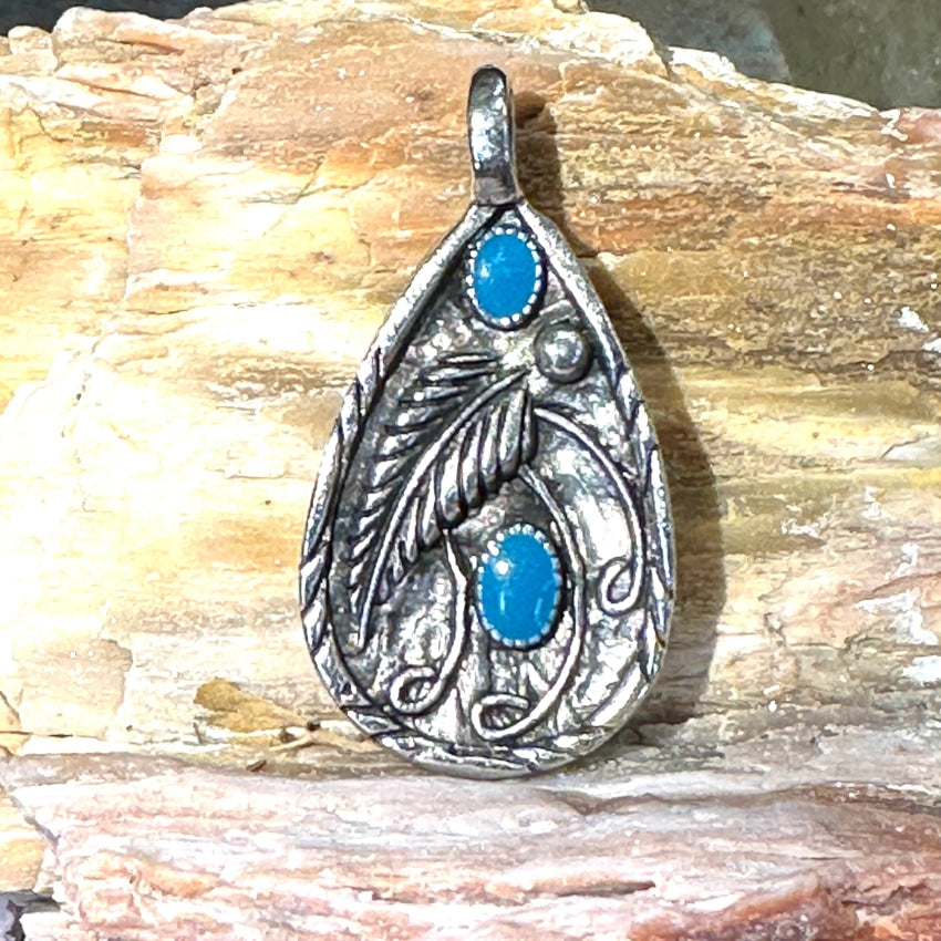 Vintage Native American sterling silver sold teardrop pendant with feathers