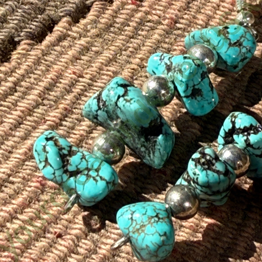 Sterling Silver & Spider Web Nugget Turquoise Pierced Earrings earrings