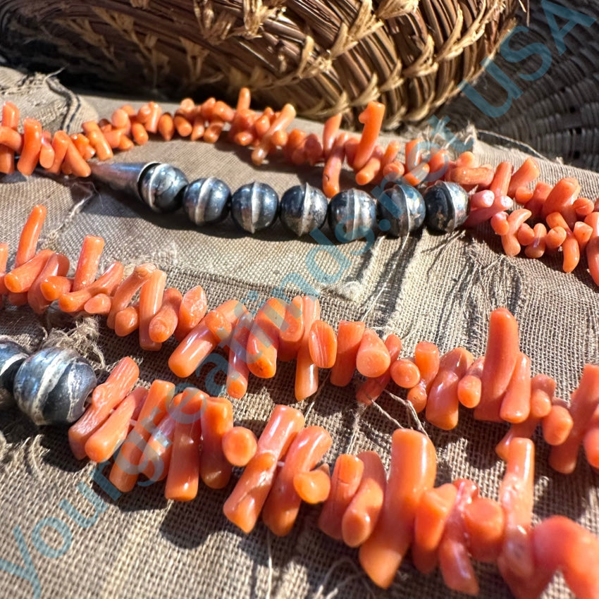 Lot - Branch Coral Necklace, 20th c., the long branch sections separated by  round coral beads, with a sterling clasp, L.- 18 in.