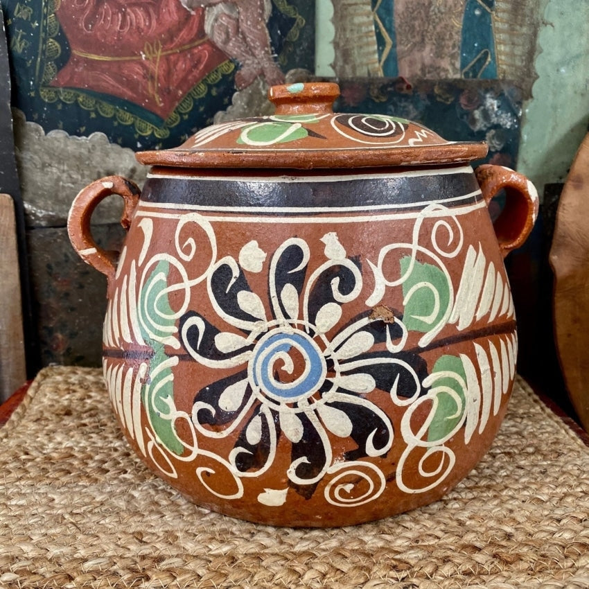 https://yourgreatfinds.net/cdn/shop/products/vintage-large-mexican-terracotta-bean-pot-hand-painted-with-spelling-error-pottery-770_1200x.jpg?v=1662299442